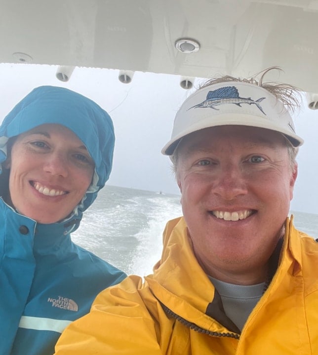 Kern and Ashley boating in bad weather on a trip to Ocracoke NC